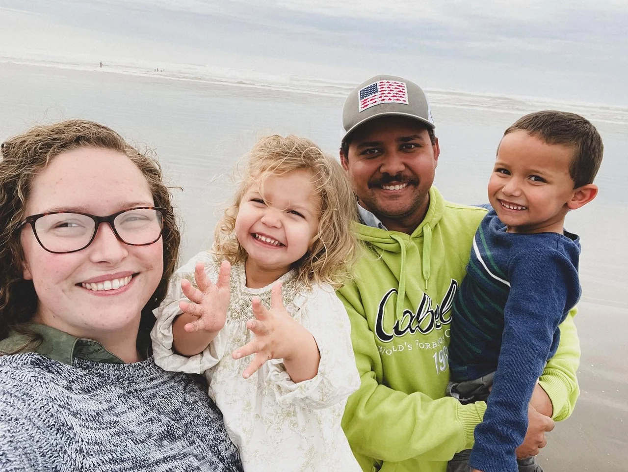 Josias Alano with his wife and their two children at the beach
