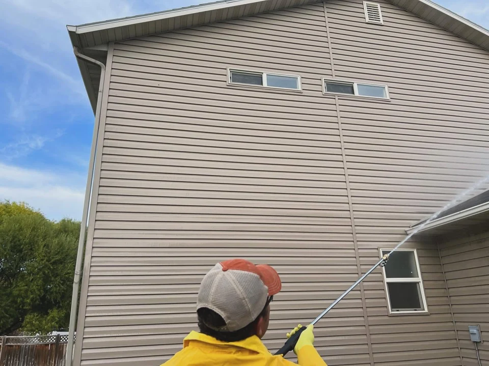 Washing the exterior siding of a home