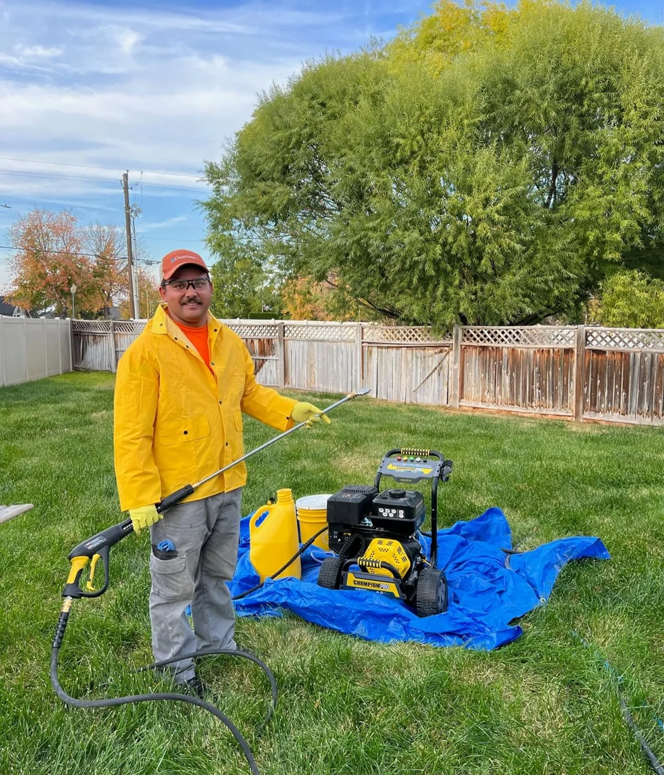 Josias with his pressure washing equipment