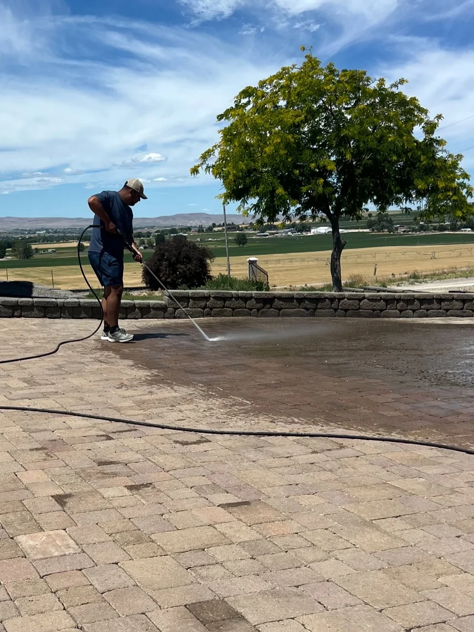 Surface cleaning a paved outdoor area